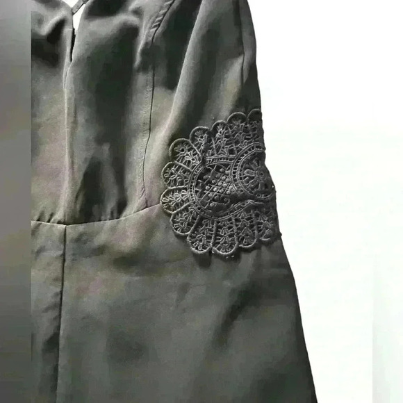 Black Romper Embroidered floral design , ruffle hem, zip up adjustable straps - Picture 3 of 13